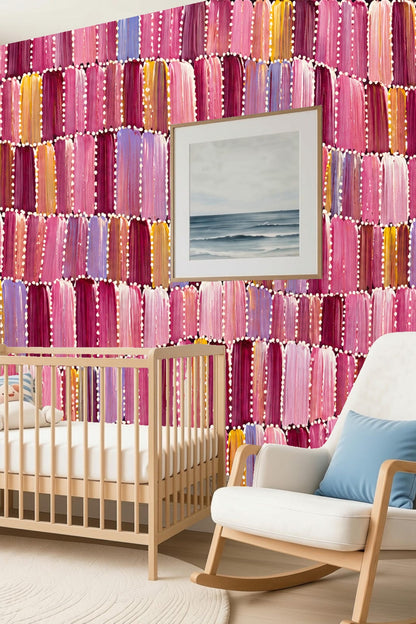Warm pastel purple and pink brushstroke wallpaper with scattered yellow accents