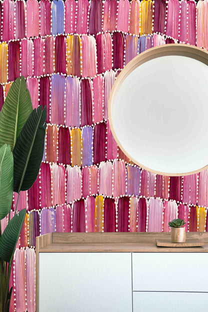 Decorative white dots outlining colorful brushstroke shapes on wallpaper surface