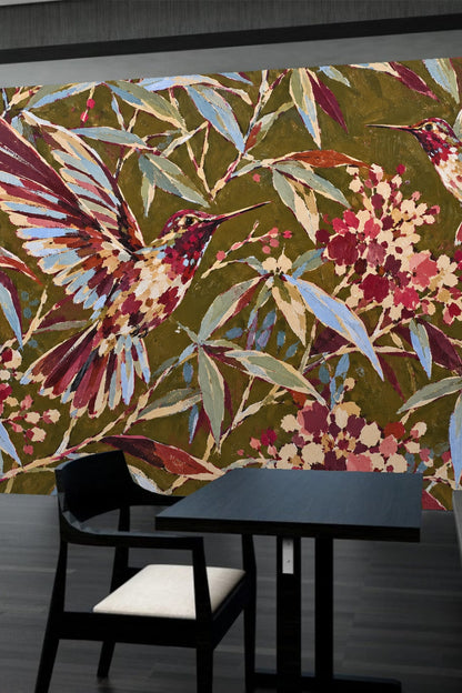 Two hummingbirds in flight amid dense painterly foliage and flowers in wallpaper design