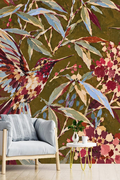 Living room wall featuring vibrant hummingbird wallpaper behind a light wood armchair and round white side table