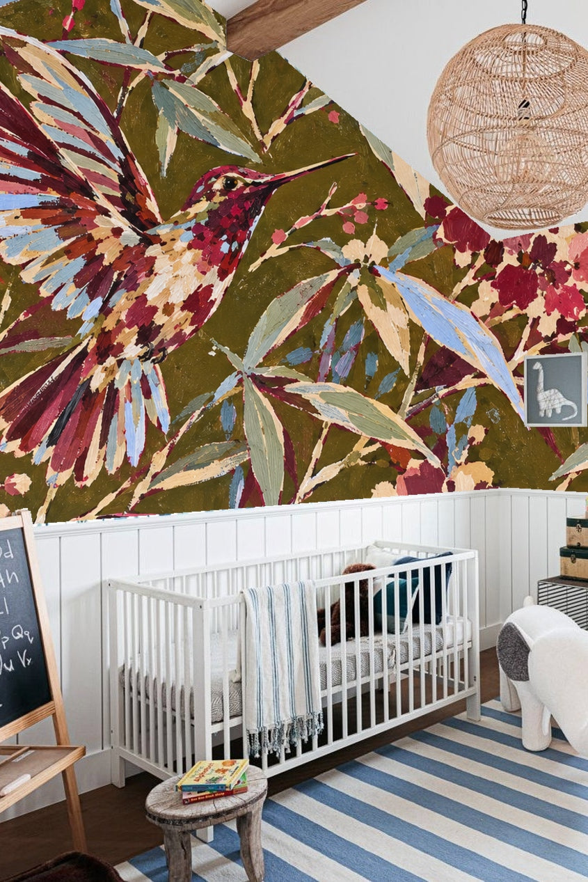 Detailed close-up of hummingbird's crimson feathers and blue-tinted leaves from the wallpaper