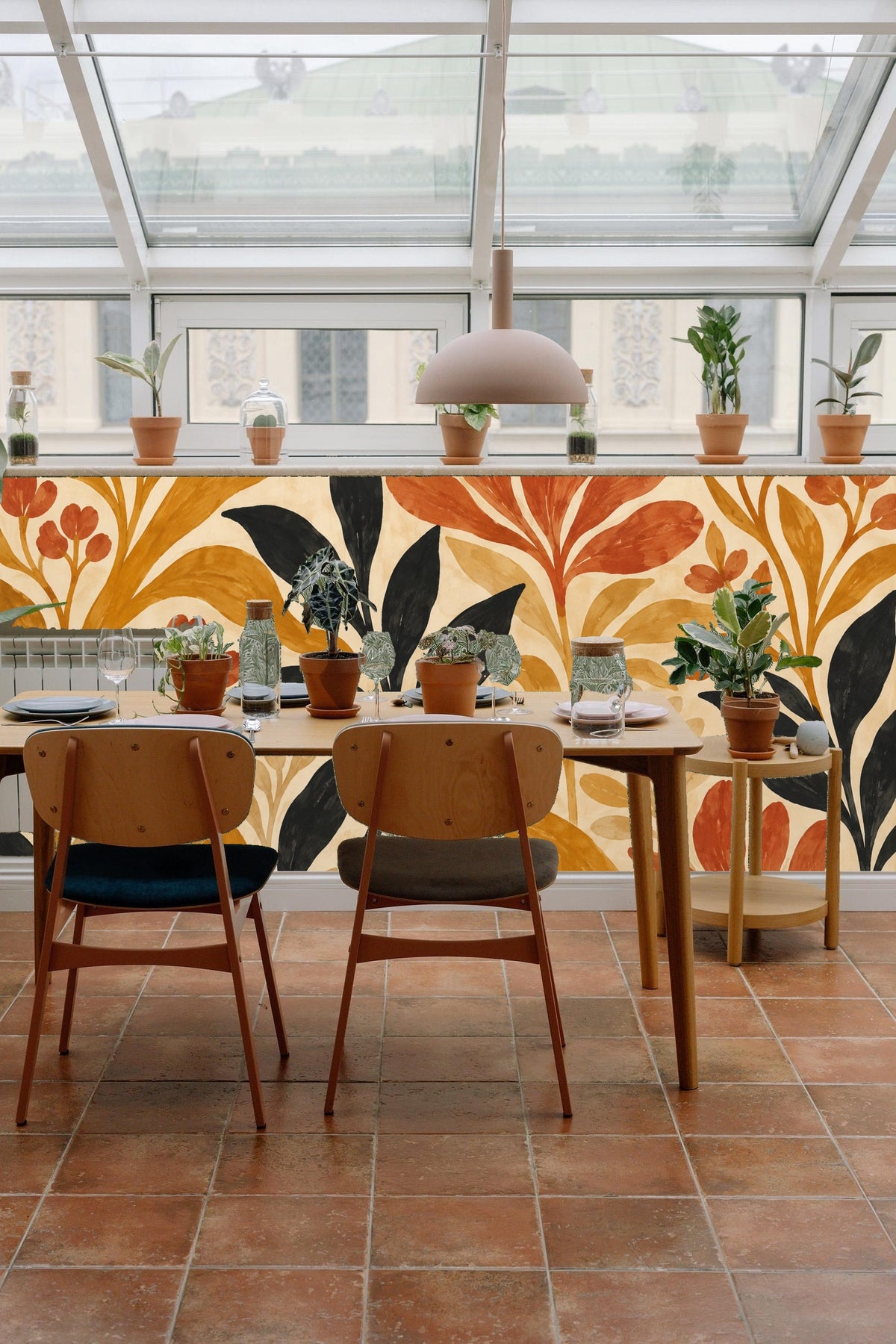 Section of the wallpaper showing black leaves providing contrast to warm earthy tones