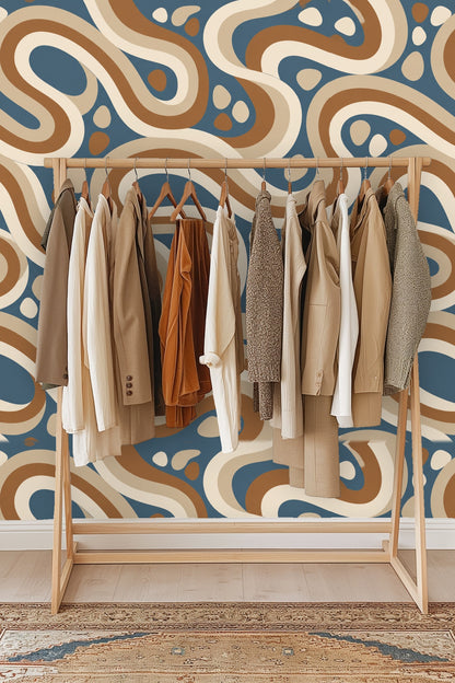 Segment of wallpaper showing cream and brown looping shapes with small dots