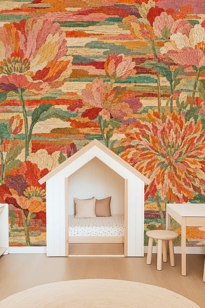 Living space wall with artful oversized floral wallpaper in warm tones behind neutral furniture