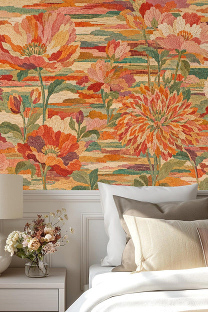 Living room with neutral sofa against large-scale floral wallpaper in burnt orange, pinks, and green