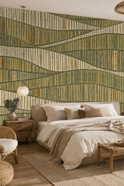 Living room with Wallpaper featuring olive green and beige textured lines behind a soft light gray chair and small table