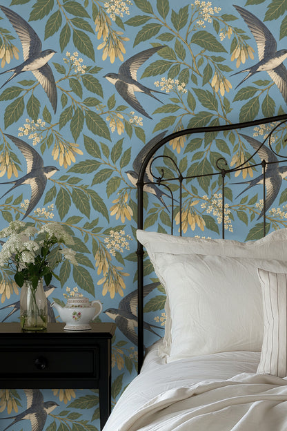 Delicate cream and yellow floral clusters interspersed with green foliage