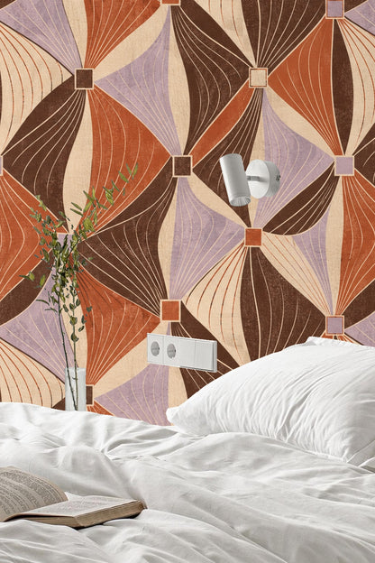 Close-up of mid-century modern style geometric wallpaper with brown, terracotta, cream, and lavender diamond shapes.