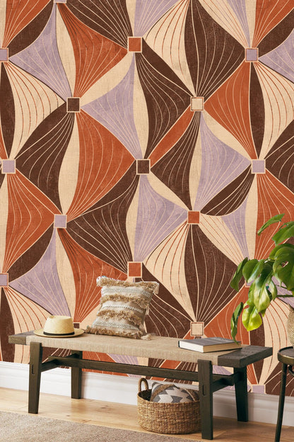 Bedroom corner featuring wallpaper with flowing ribbons and diamond grids in warm earthy tones.