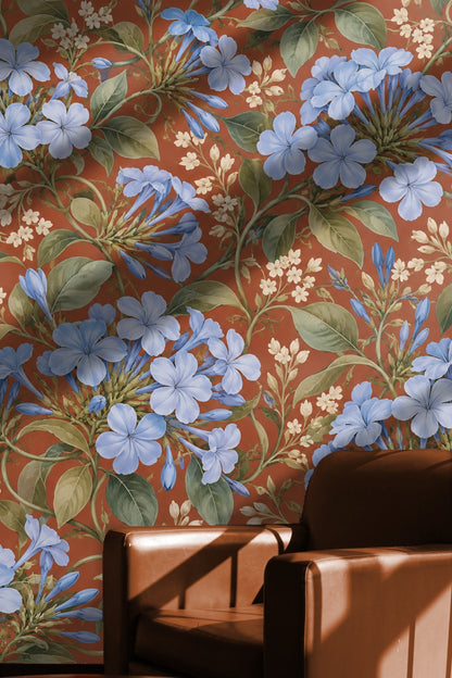 Interior room corner with blue floral wallpaper and wooden floor detail