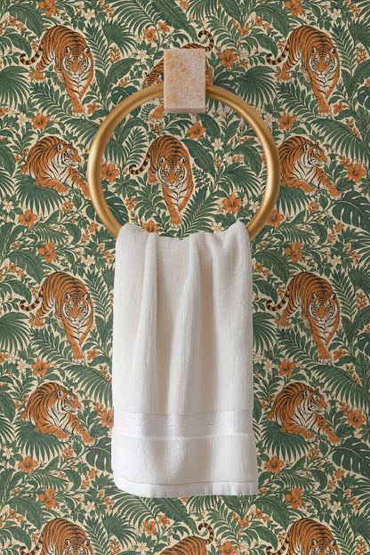 Large tropical leaves such as monstera and palm surrounding tiger motifs.
