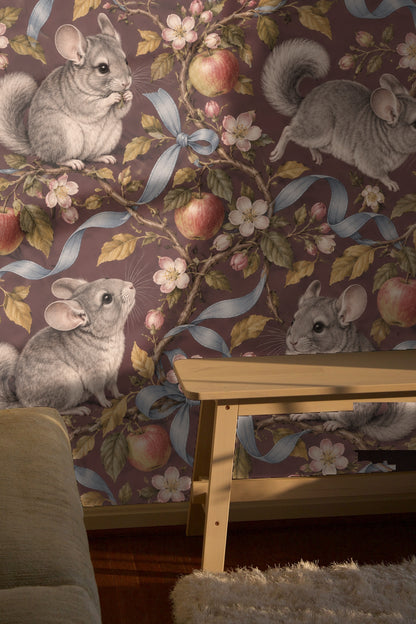 Blue ribbons knotted around apple branches creating visual flow on wallpaper.