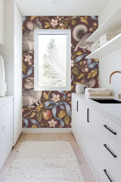 Section of wallpaper highlighting twisting apple branches with pink flowers and tied blue ribbons.