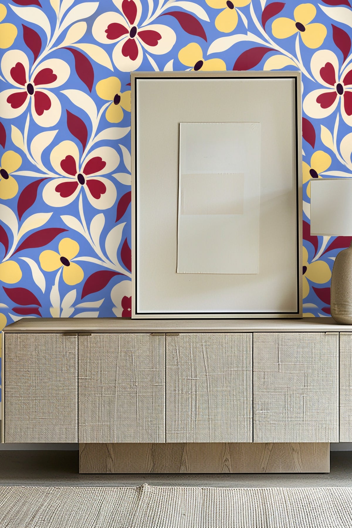 Room setting with blue velvet sofa against Vintage Petal Swing wallpaper featuring bold floral motif