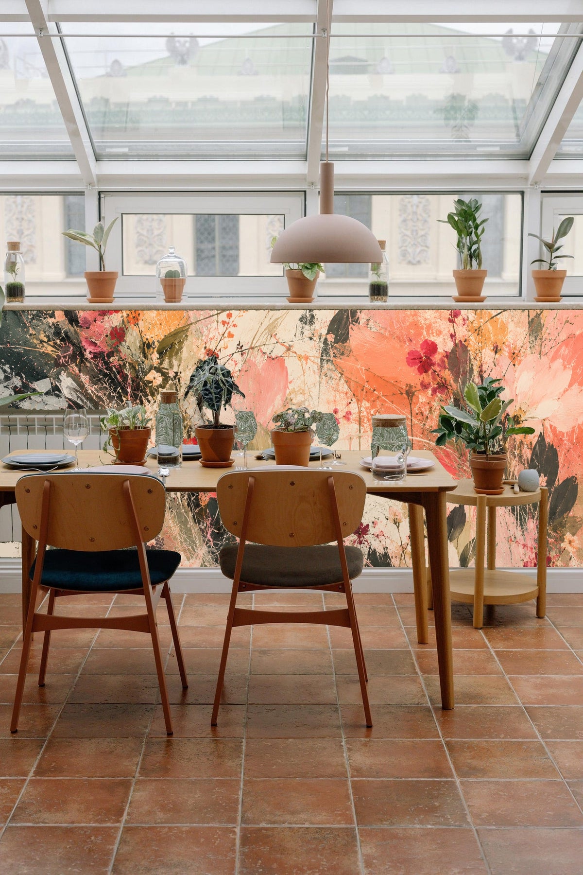 Living room wall covered in coral and green floral abstract mural