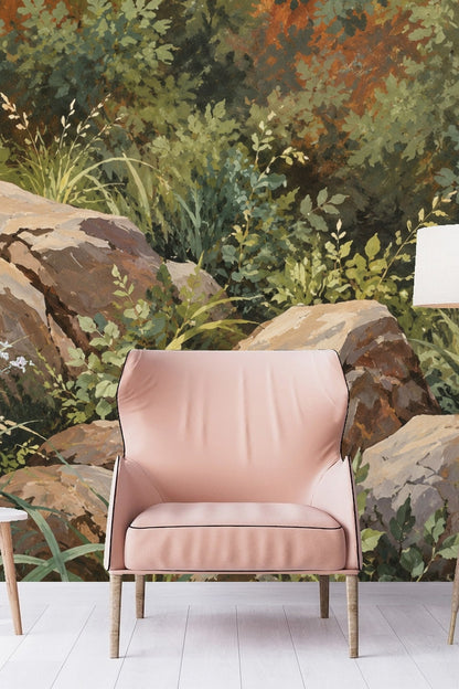 Interior room photo featuring verdant boulder landscape wallpaper behind a blush pink armchair and tripod lamp