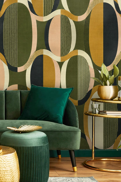 Bedroom wall with Oval Groove Wallpaper behind green velvet scallop-edged headboard and white bedding.