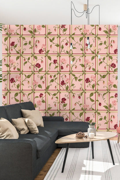 Close-up of pink sweet pea flower and green leaves on lattice background