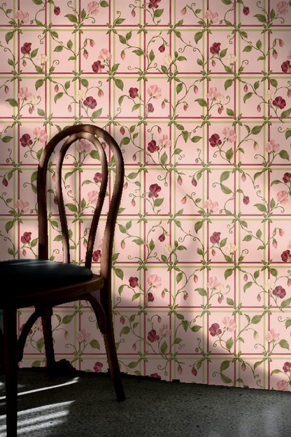 Floral lattice wallpaper behind a cozy bed with velvet pillows