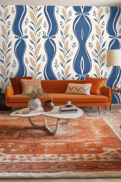 Cozy vignette with candle and small flowers in front of blue ribbon wheat wallpaper