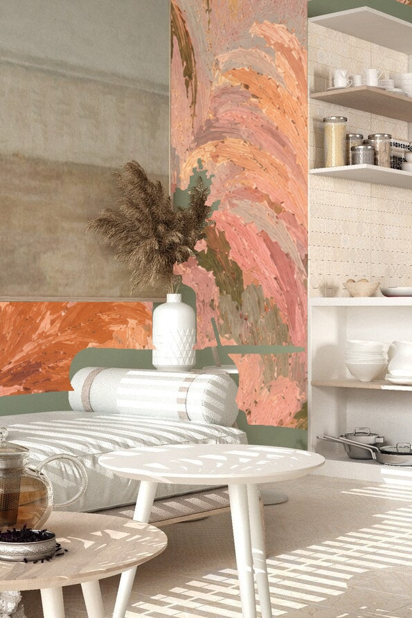 Detail of layered palm and fern foliage in soft pink and muted olive palette