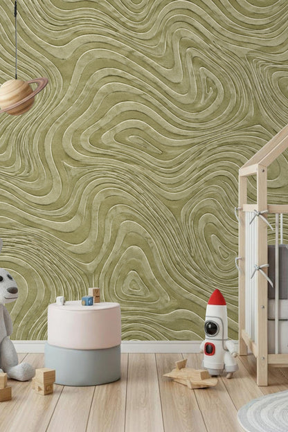 Natural light highlighting textured olive contour wallpaper in a nursery