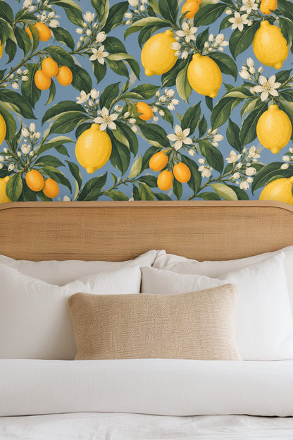 Wallpaper artwork showing detailed yellow lemons, kumquats, white citrus blossoms, and green leaves on blue background
