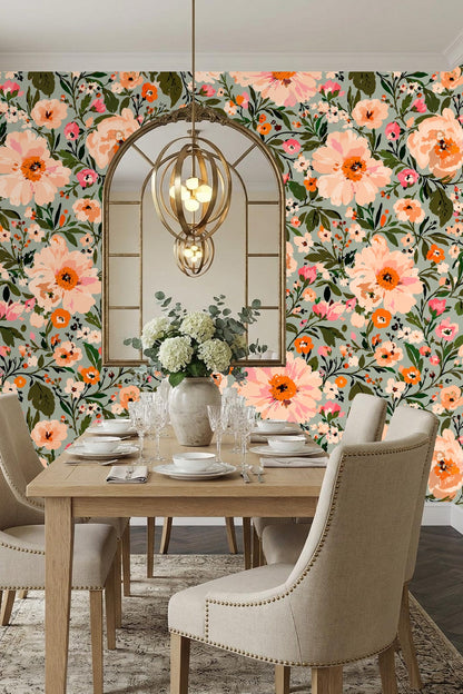 Bedroom setting with peach floral wallpaper behind beige upholstered bed