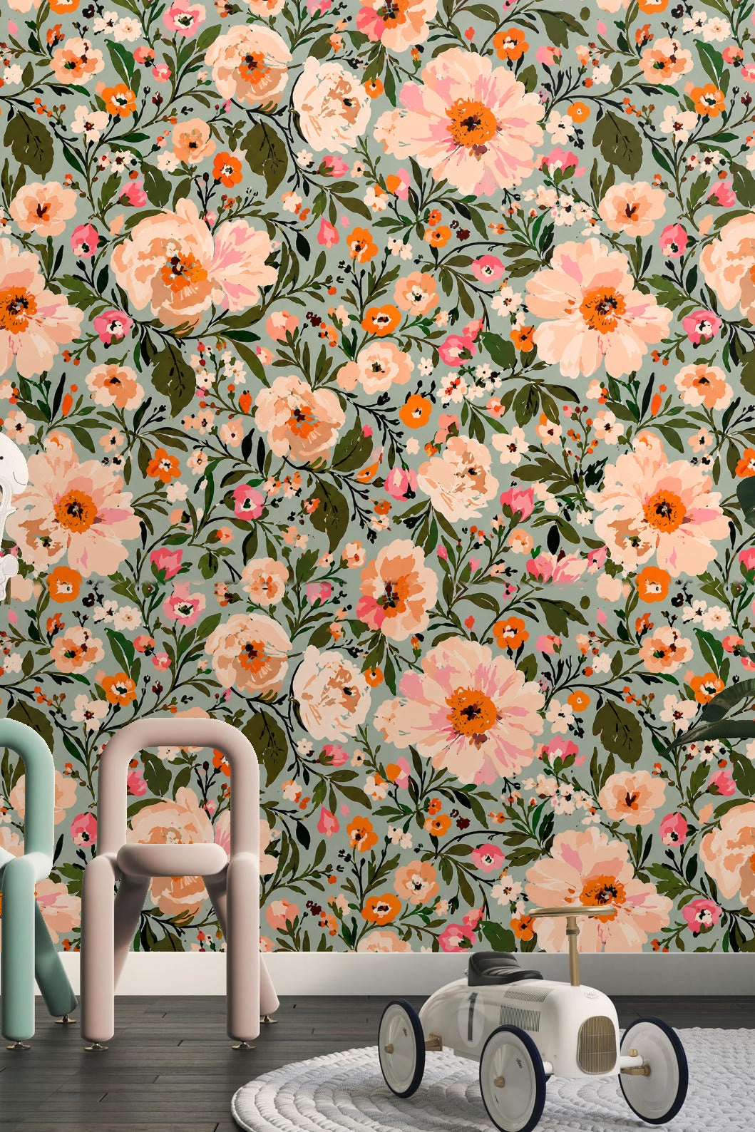 Detail of coral and pink flowers with dark centers on wallpaper