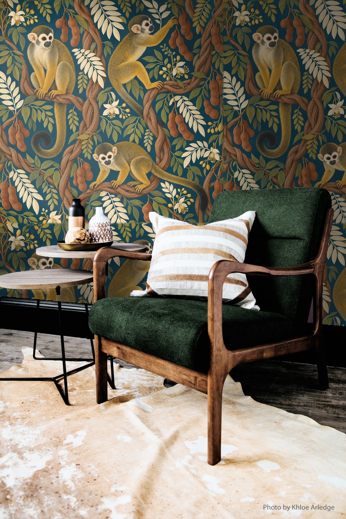 Vibrant teal wallpaper as seen in a cozy, nature-inspired room interior