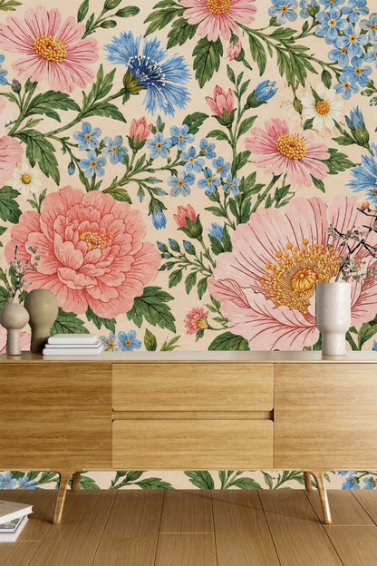 Detailed close-up of wallpaper with pink peonies and blue bluets on cream background