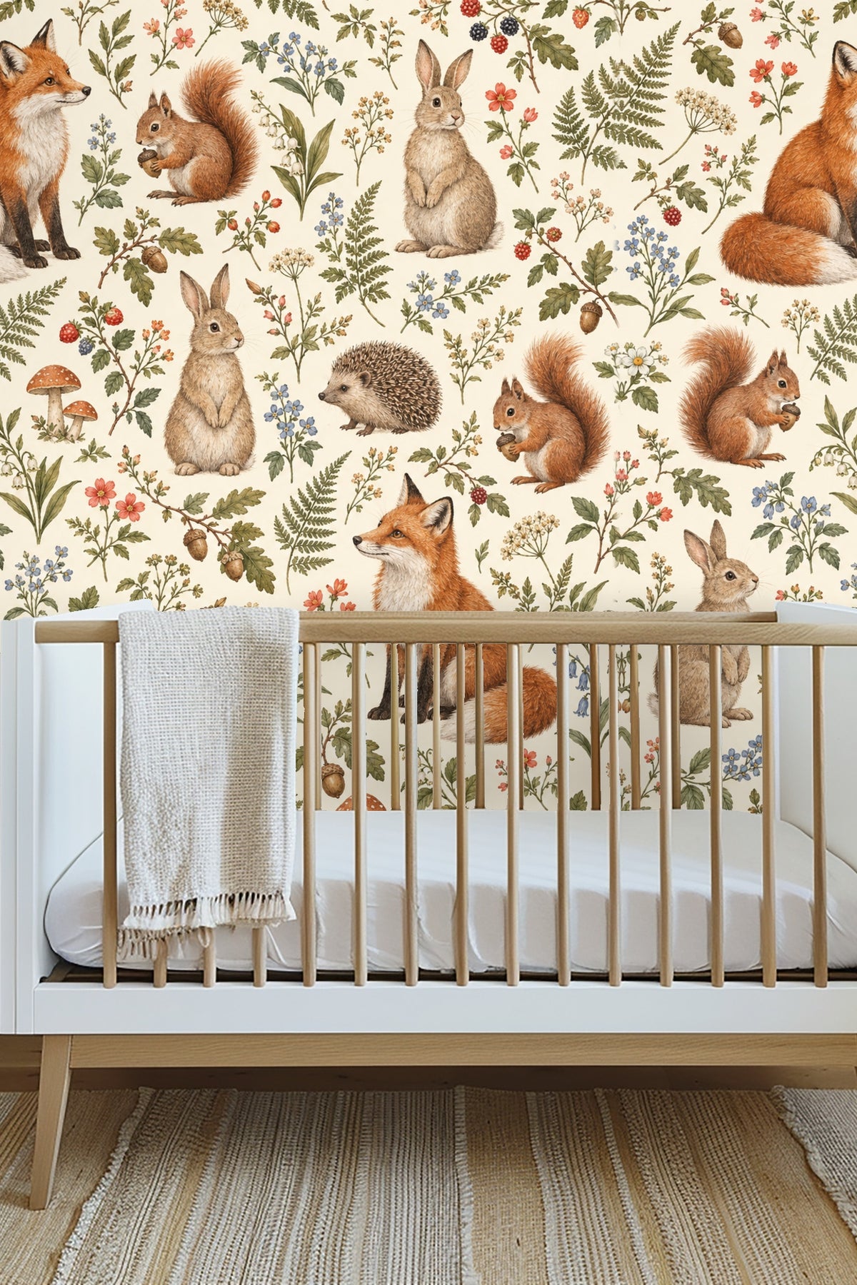 Living room scene with neutral sofa and Woodland Reverie Wallpaper of forest animals and botanical details.