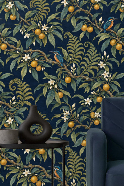 Bedroom scene with Kingfisher Citrus Branch wallpaper and olive-green velvet pillows