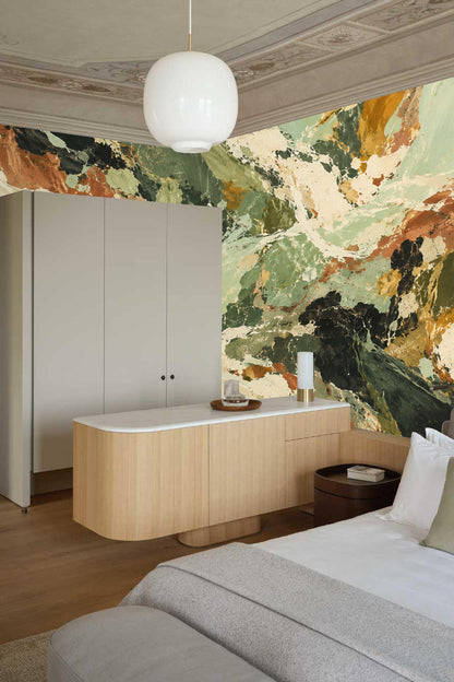 Wall with layered abstract brush strokes in earthy colors