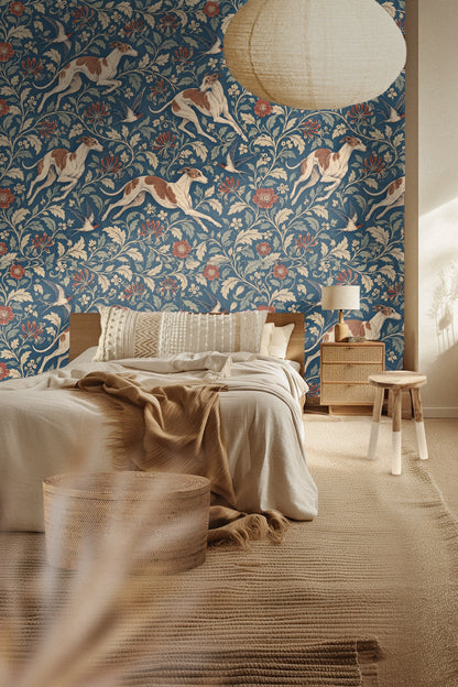 Entryway decorated with blue floral wallpaper featuring running whippets and swallows behind a natural textured sideboard and minimalist art