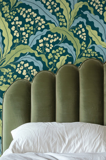 Arched doorway framing warm wood and cream rug against wallpaper