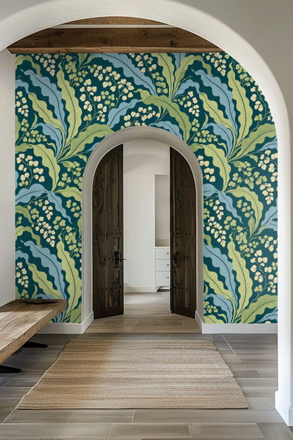 Detailed close-up of Verdant Wave Botanical wallpaper showing flowing light blue and chartreuse leaves on teal background