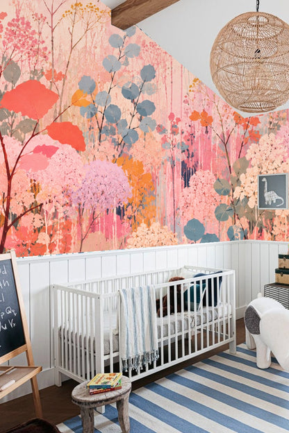 Bedroom interior with gray bedding and a pink and coral floral wallpaper behind the bed