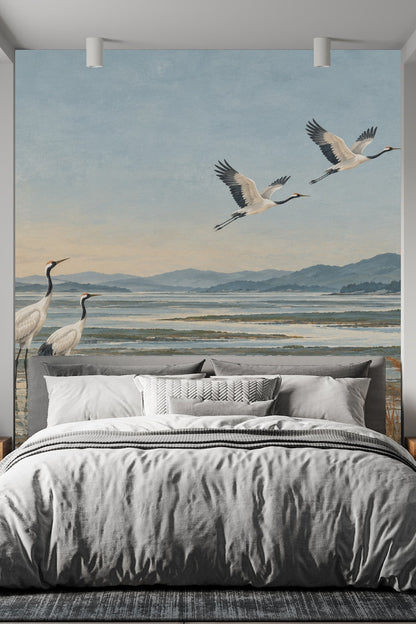 Knitted throw pillow and bed linens complementing mural colors.