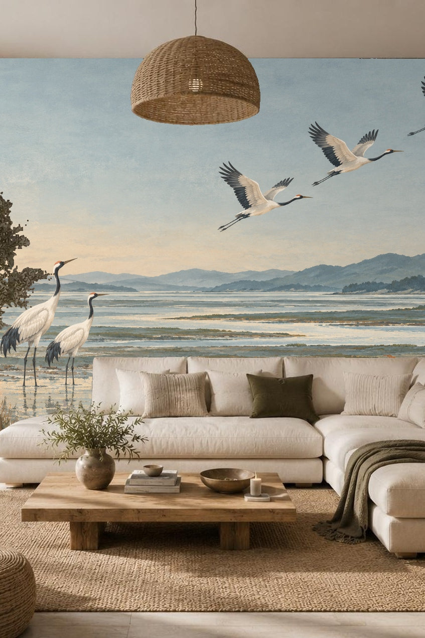 Artwork showing two red-crowned cranes standing in a misty wetland at dusk with mountains beyond.