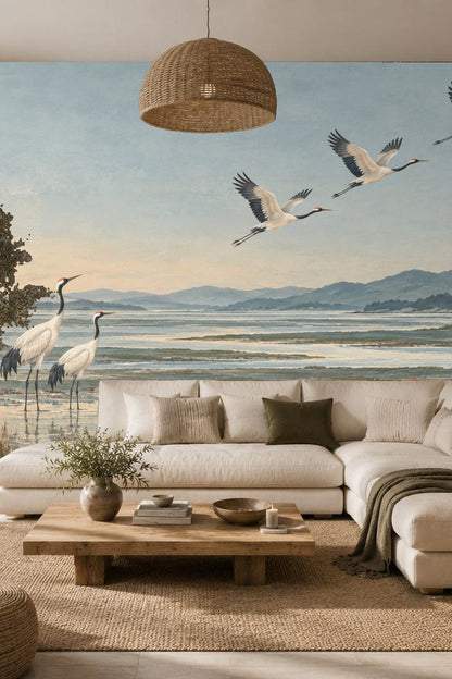 Artwork showing two red-crowned cranes standing in a misty wetland at dusk with mountains beyond.