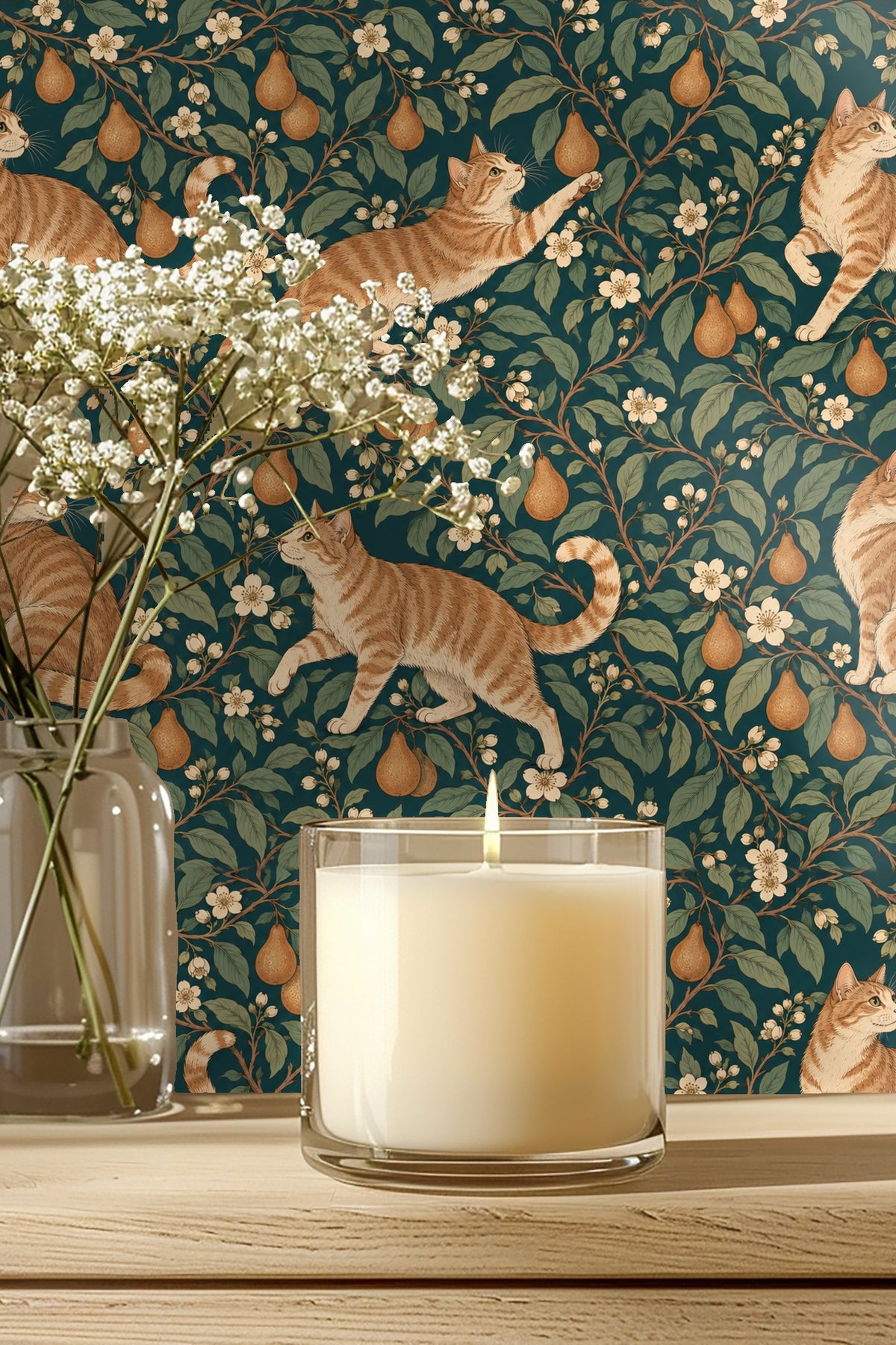 Bathroom scene with wooden medicine cabinet and wallpaper featuring orange tabby cats and pear branches on teal