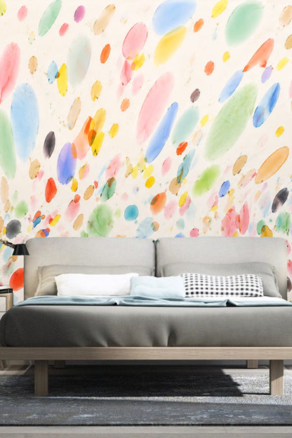 Bedroom with grey bed and Chromatic Droplets wallpaper creating a joyful atmosphere.