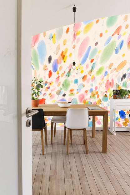 Various-sized watercolor droplet shapes in blues, pinks, yellows, greens, and oranges.