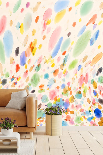 Close-up of watercolor multicolor elliptical and circular spots on cream background.
