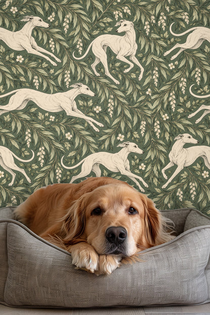 Illustration of ivory whippets running through holly branches on moss-green background.