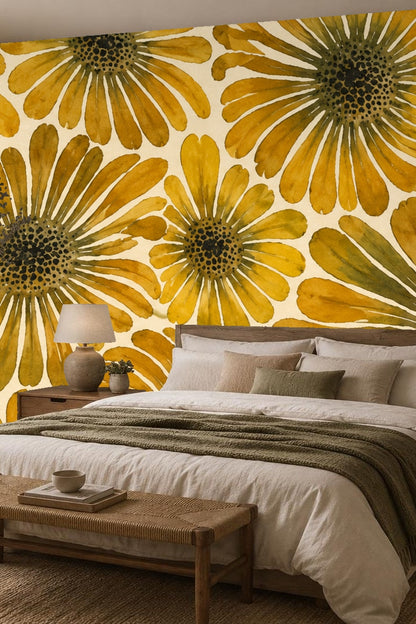 Close-up of watercolor daisy wallpaper pattern showing large ochre petals and dark centers on cream background