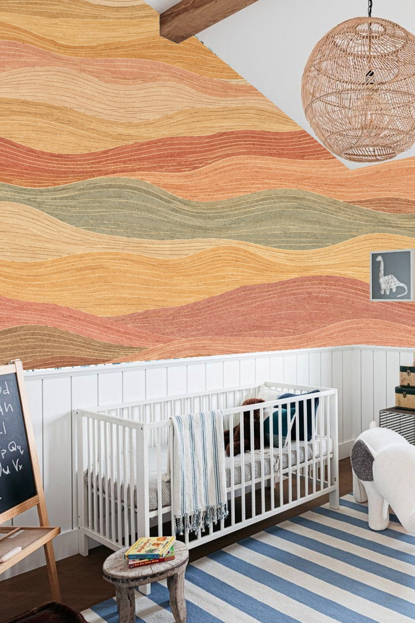 Close-up detail of layered wavy stripe wallpaper showing texture and color shifts in earth hues