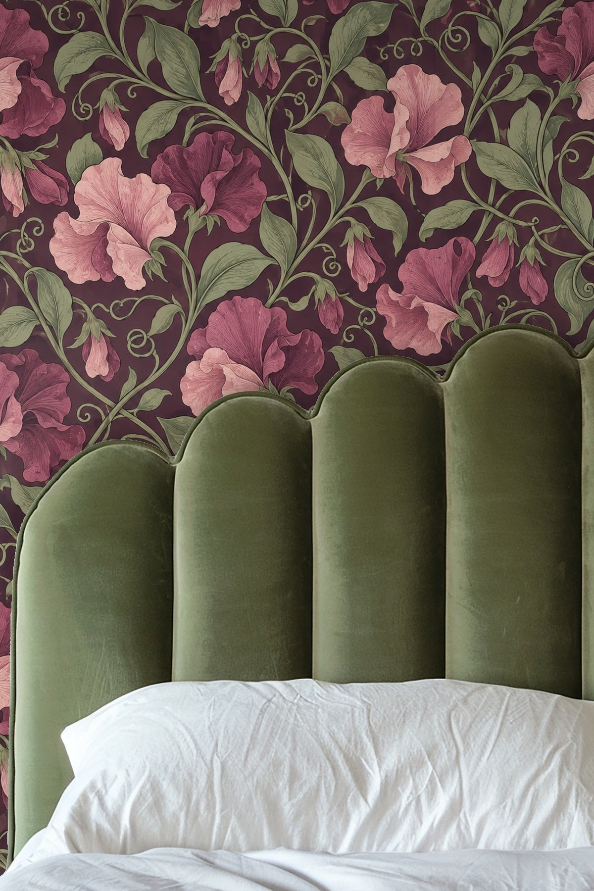 Palm leaf plant beside wallpaper featuring dusty rose sweet pea motif