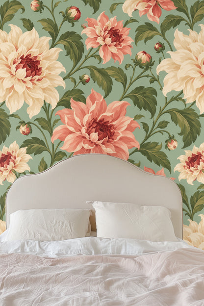 Wallpaper close-up showing large coral and cream dahlia flowers with green leaves on a sage background